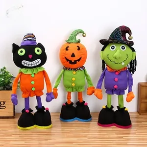 Detail of Halloween plush trio featuring long-legged pumpkin, witch, and cat dolls