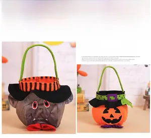 Detailed view of Halloween felt candy bags featuring orange pumpkin and grey vampire designs