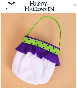 Detail of Halloween candy bag with green polka dots and purple ruffles for kids party