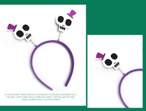 Detail of Halloween purple spring headband with white felt skull and mini hat ornaments