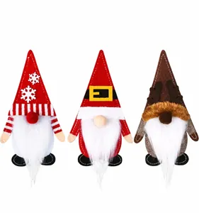 Detailed view of three festive Christmas gnome silverware holders in felt and knit fabric