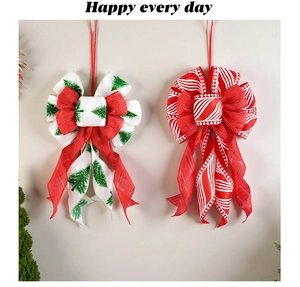 Detail of red and white Christmas tree bows with festive patterns and hanging loops