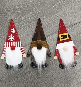 Three-piece Christmas gnome felt cutlery holders with snowflake and reindeer motifs