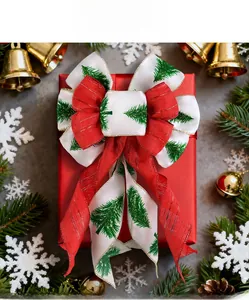 Detail view of red and white Christmas bow with green tree pattern in a gift box context