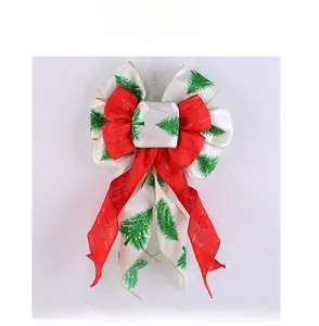 Macro detail of Christmas tree bow hanger with snowflake edges and glitter ribbon finish