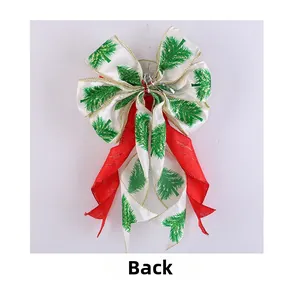 Detail view of red and white Christmas tree bow hanger with golden wire edges from the back