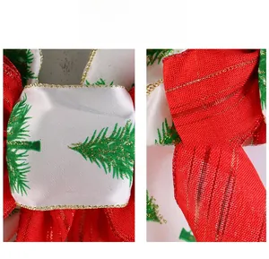 Detail showing the red velvet fabric with gold edge and green pine tree prints for Christmas bows