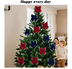 Detail of dark red and blue velvet Christmas bows with glitter edges on a holiday tree