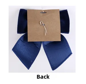 Rear view of large navy blue velvet Christmas bow with satin ribbons and wire tie