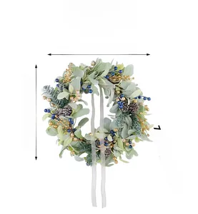 Detail view of 40cm Christmas wreath with pine cones, golden berries, and green leaves
