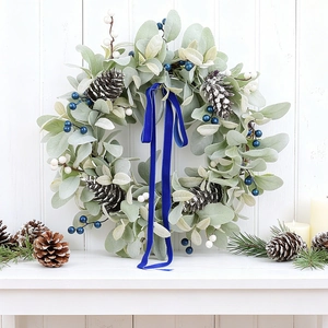 Artificial rabbit ear leaf wreath with pine cones, berries and blue velvet ribbon bow