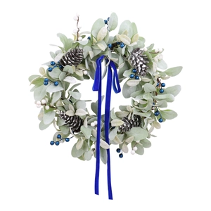 Artificial wreath with pale green leaves, pinecones, berries and royal blue velvet ribbon