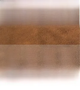 Macro detail of natural pebble grain texture on brown genuine cowhide leather roll