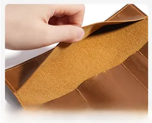 Macro shot of soft leather interior and reinforced stitching on a brown pencil roll