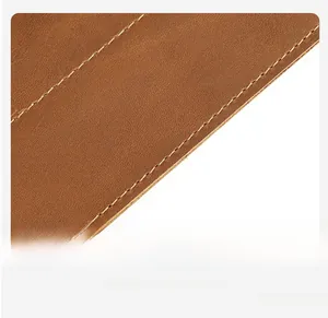Detail view showing high-quality cowhide texture and precise stitching on brown pen roll