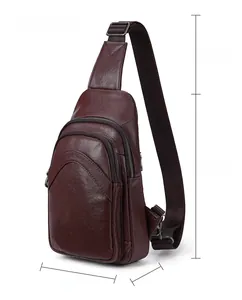 Detailed view of brown leather crossbody bag dimensions 18x30cm with silver zippers