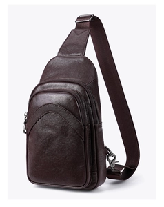 Detailed side view of high-quality brown leather crossbody bag with silver hardware