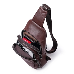 Dark brown vegetable-tanned leather crossbody bag with multiple zippers and spacious compartments