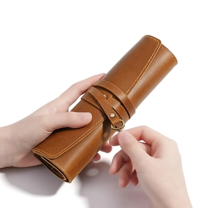 Vintage crazy horse leather roll-up pen case with brown strap and metal D-ring buckle