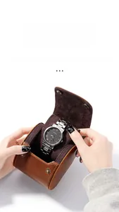 Detailed view of brown crazy horse leather watch pouch with soft lining and snap button
