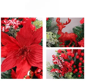 Detail of Christmas wreath with red glitter poinsettia flower and reindeer ornament