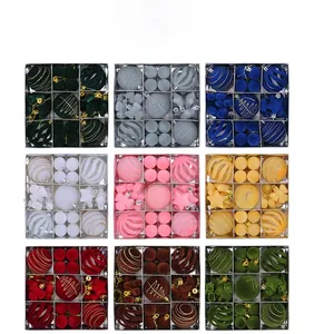 Macro shot of 9-grid Christmas ball gift set with glitter and matte textures