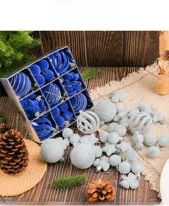 Detail of Christmas ornament set with blue and grey flocked balls in a grid gift box