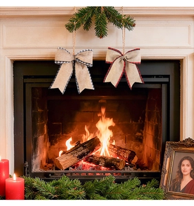 Detail of burlap Christmas bows with plaid edges hanging on a festive mantel