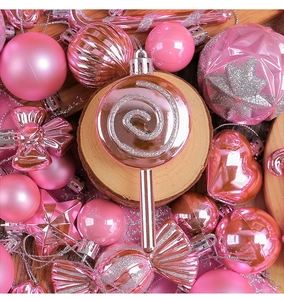 Close-up of pink Christmas ornaments set with lollipop and star shapes in matte finish