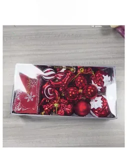 Detail of a festive Christmas ornament set with red and white balls in a clear gift box