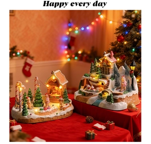 Detail of resin Christmas gingerbread house with LED lights and snow scene miniatures