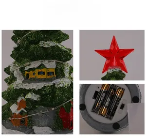 Detail view of battery compartment for glowing Christmas tree music box ornament