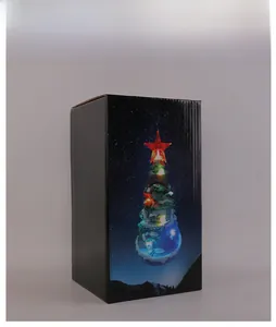 Detailed packaging box showing luminous Christmas tree scene and festive decorations title