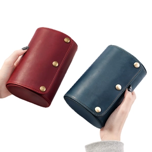 Uhrenrolle aus Vintage-Leder mit drei bronzefarbenen Druckknöpfen in Weinrot und Dunkelblau