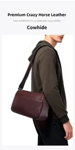 Side view of man wearing dark red-brown crazy horse leather crossbody messenger bag