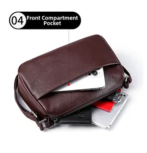 Detail of vegetable-tanned leather crossbody bag with front pocket and silver hardware