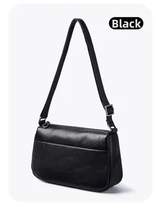Detailed view of black vegetable tanned leather texture and silver metal strap buckle