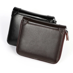 Detailed view of leather card holder wallets with crocodile pattern and secure zippers
