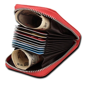 Detail of red leather accordion card holder showing large capacity for cards and cash
