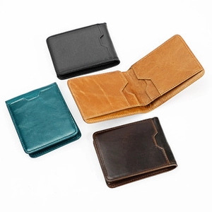 Detailed view of men's leather wallets in four colors showing interior card slots