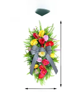 Detail view of colorful artificial rose swag with striped bow and 50x25cm dimensions