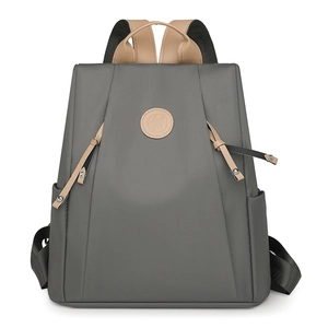 Grey nylon anti-theft backpack for women with large capacity and stylish leather accents