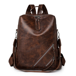 Vintage brown checkerboard backpack with dual zipper pockets and large capacity design