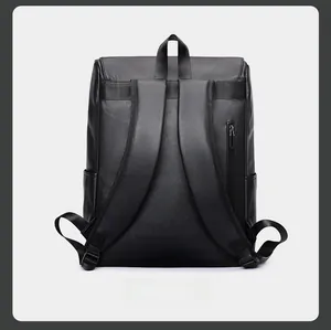 Detail view of the black leather backpack featuring wide straps and back anti-theft zipper