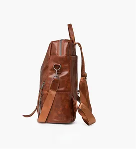 Detail of checkered backpack showing side pocket and high-quality lychee texture leather