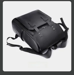 Detailed top view of black leather backpack featuring dual buckles and breathable mesh straps