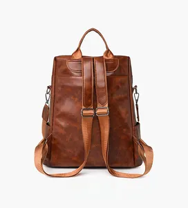 Rear view of brown checkered backpack with adjustable straps and high-quality leather texture