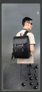 Detail showing water-resistant texture and durable high-density fabric of the black backpack