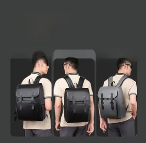 Detail view of stylish men's travel backpack with dual buckle straps and textured finish