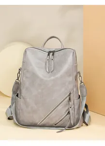 Detail of grey checkerboard backpack with lychee texture and adjustable straps